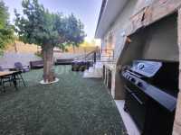 patio trasero con barbacoa