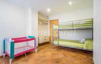 Dormitorio literas y cuna